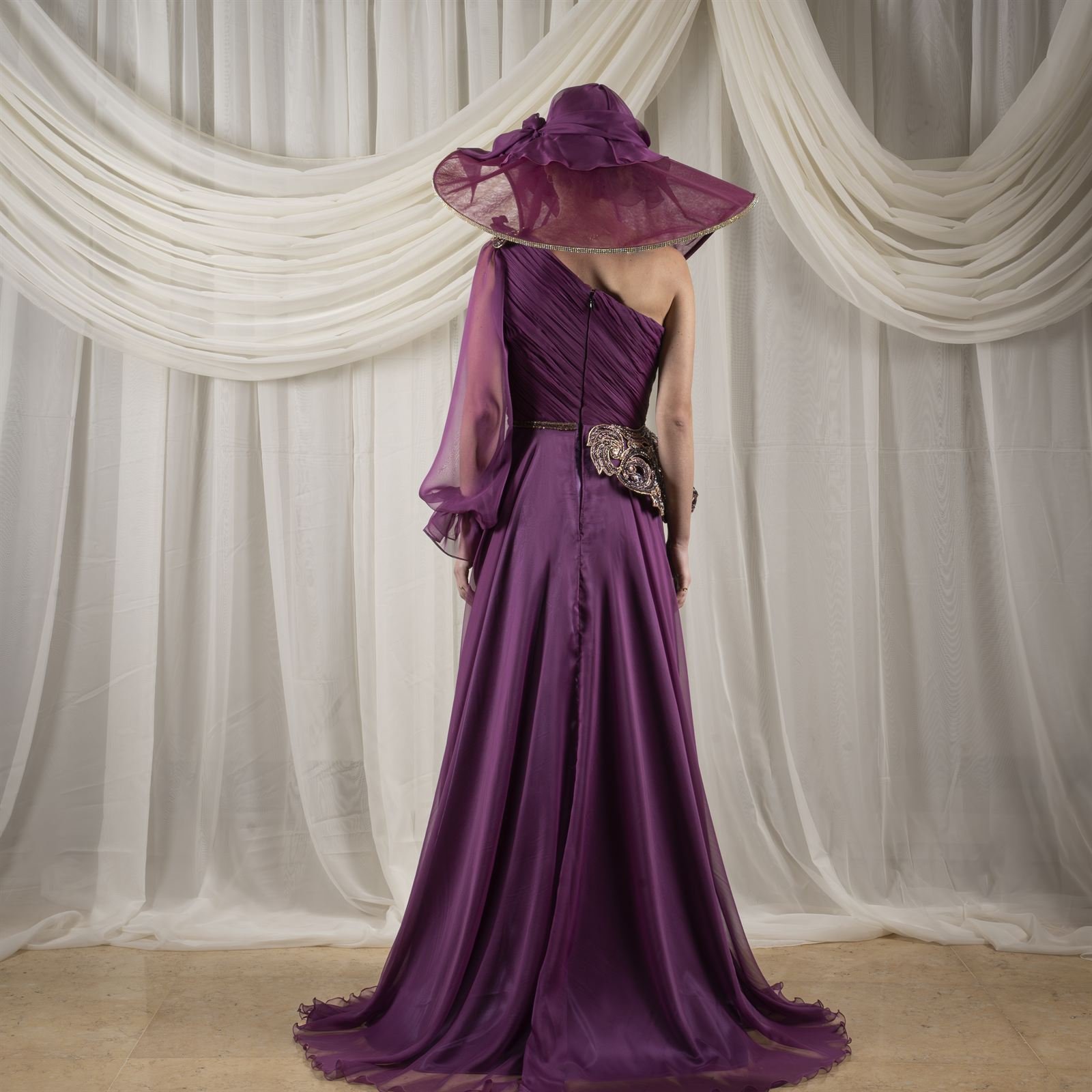 Purple one-shoulder gown from behind